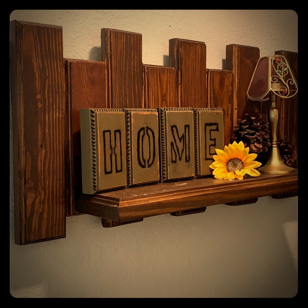 Hand made wooden shelf with home sign